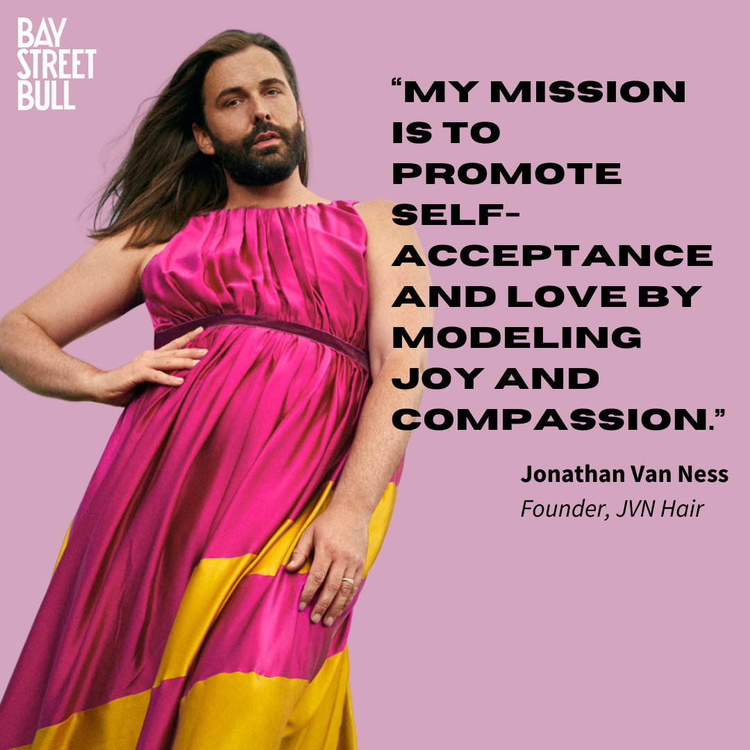 Jonathan Van Ness in pink caftan against pink background with quote