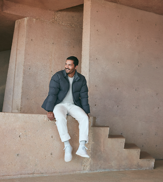 Photo of guy wearing Allbirds puffer and white pants