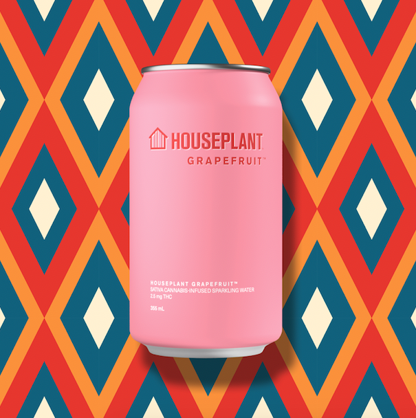 Houseplant beverage in pink can against diamond pattern background