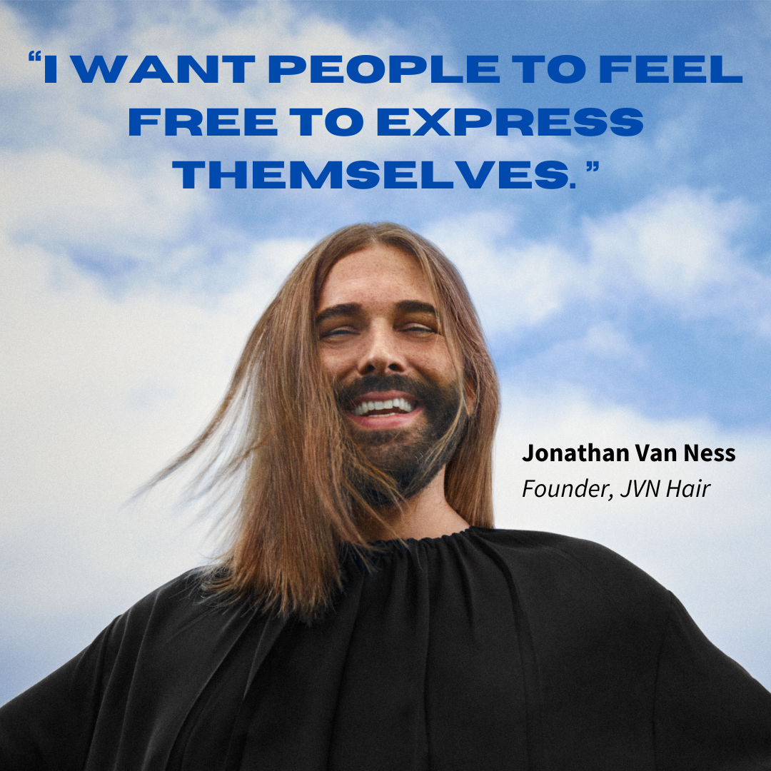 Jonathan Van Ness smiling in black shirt with blue sky and quote