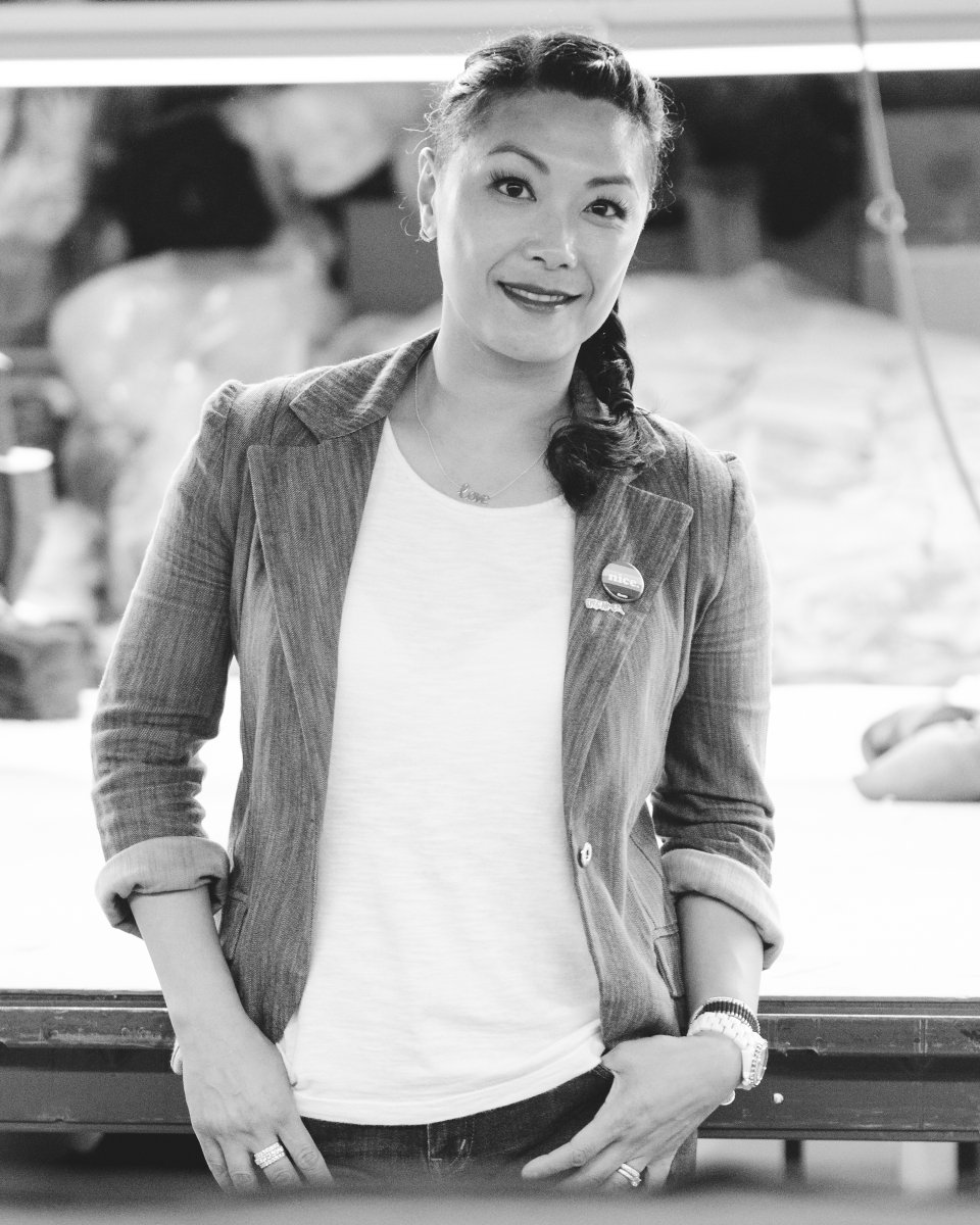 Black and white photo of woman in blazer and t-shirt