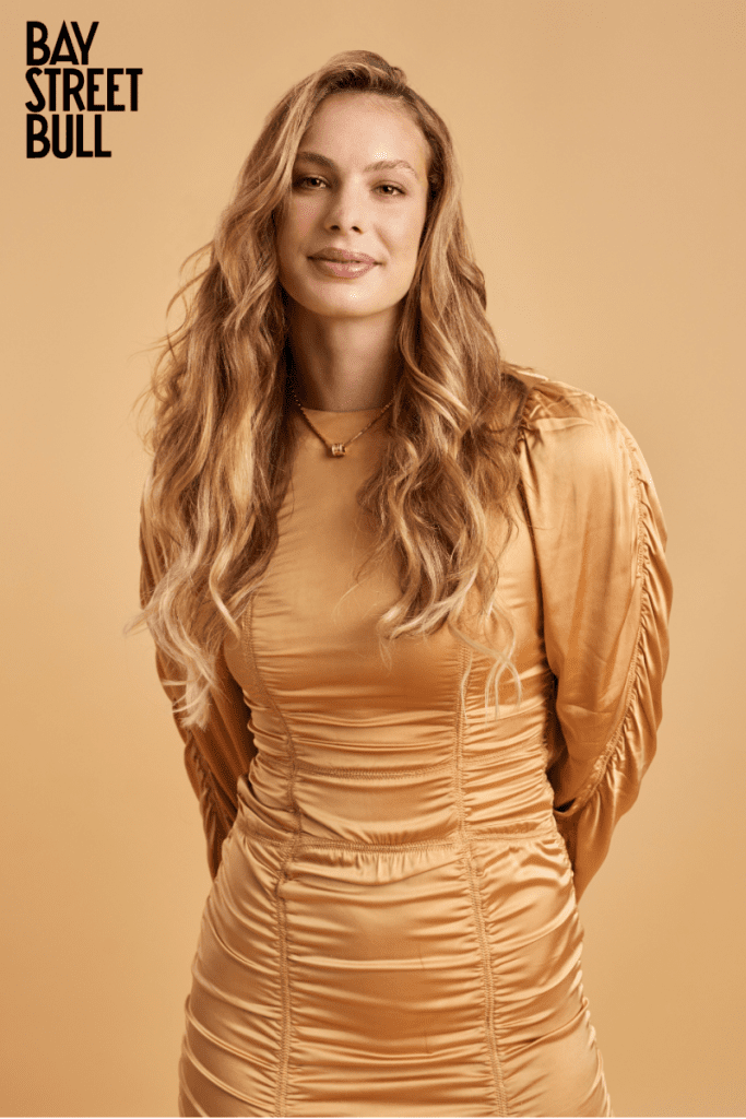 Penny Oleksiak in gold dress