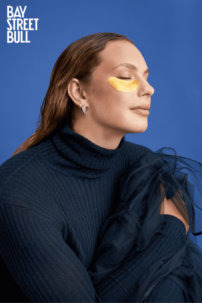 Penny Oleksiak in navy turtleneck and gold eyemask