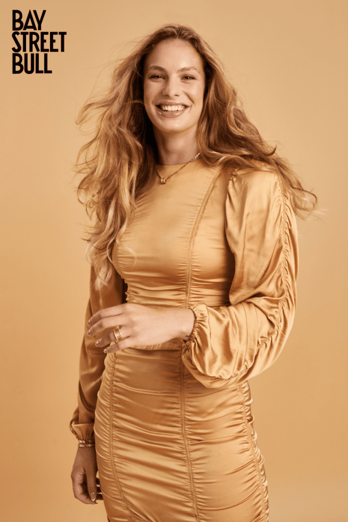 Penny Oleksiak in gold dress