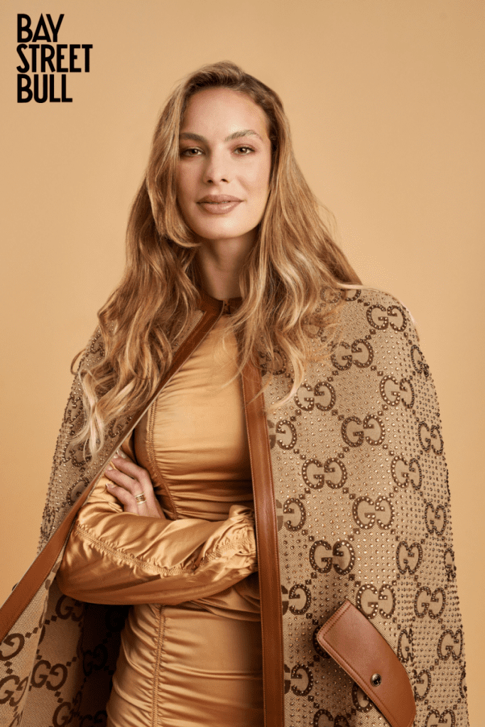 Penny Oleksiak in beige Gucci cape and gold dress