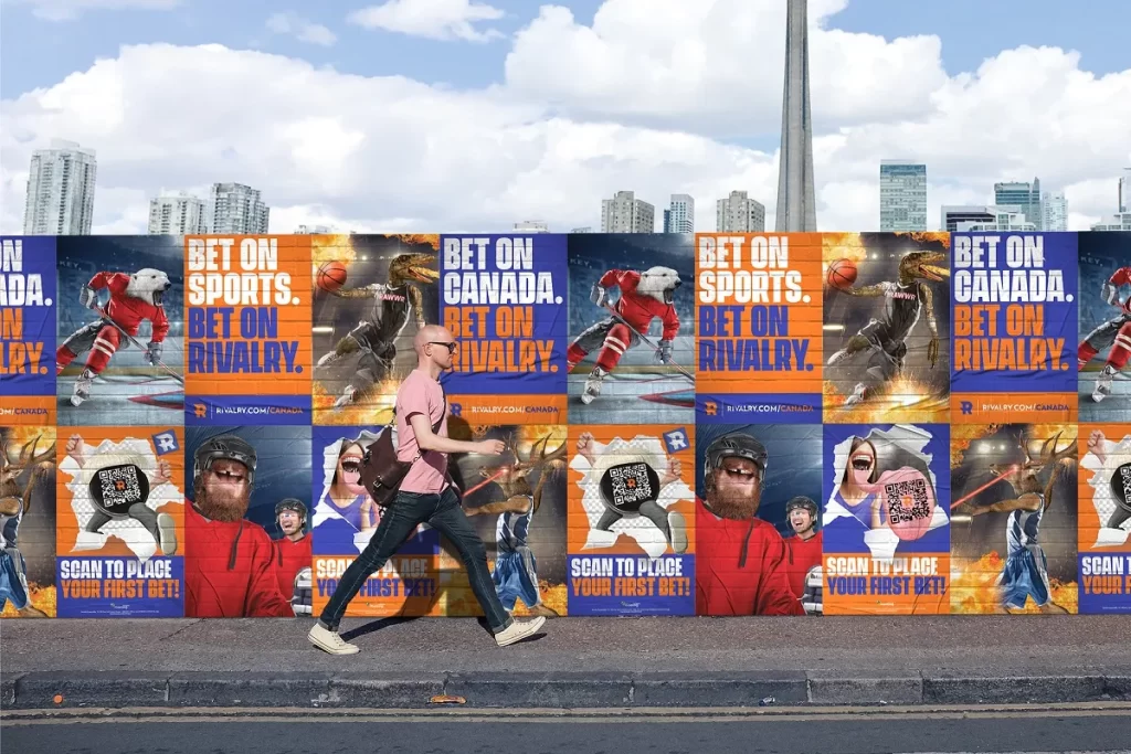 Man in Toronto walks past Rivalry advertisement in the city