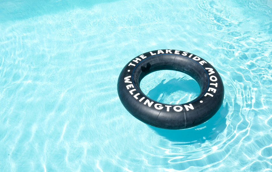 Motel pool with branded inner tube