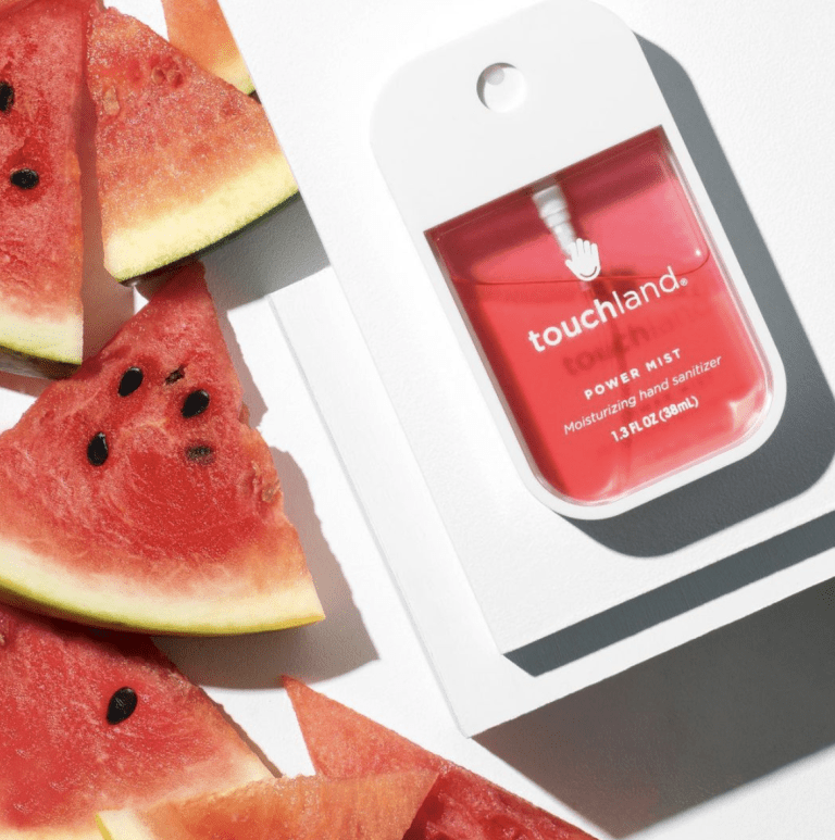 touchland sanitizer next to watermelon to represent sanitizer that won't dry out your hands