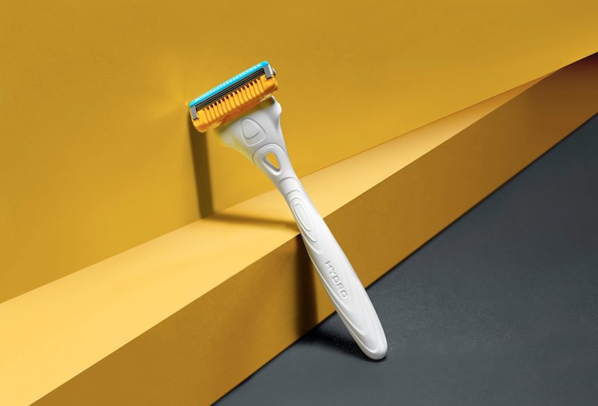 Schick razor against yellow wall