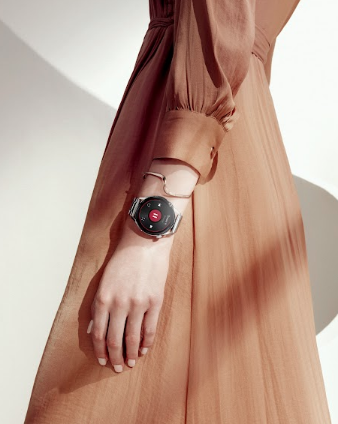 Woman wearing smart watch in a dress