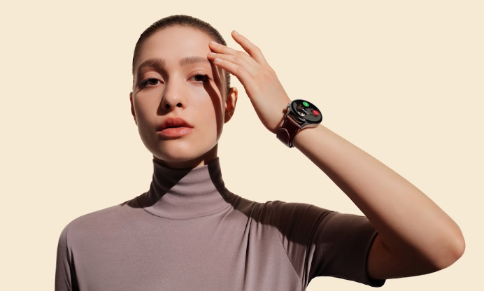 Woman holding hand up with smart watch