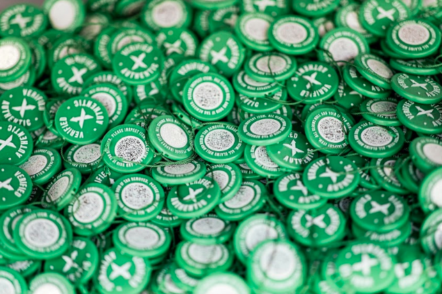 StockX Authentication green stickers piled together