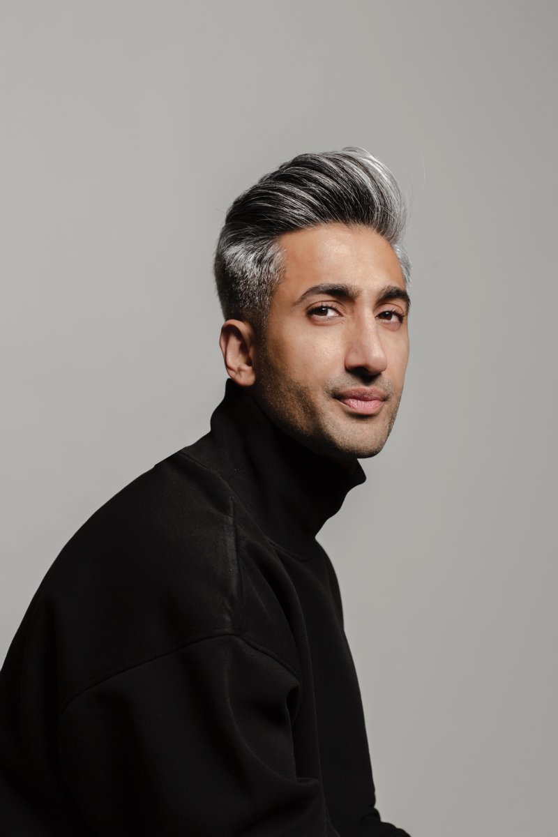 Image of Tan France in black turtleneck against grey background