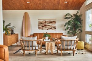 Motel lobby with sofa, surfboard, chairs