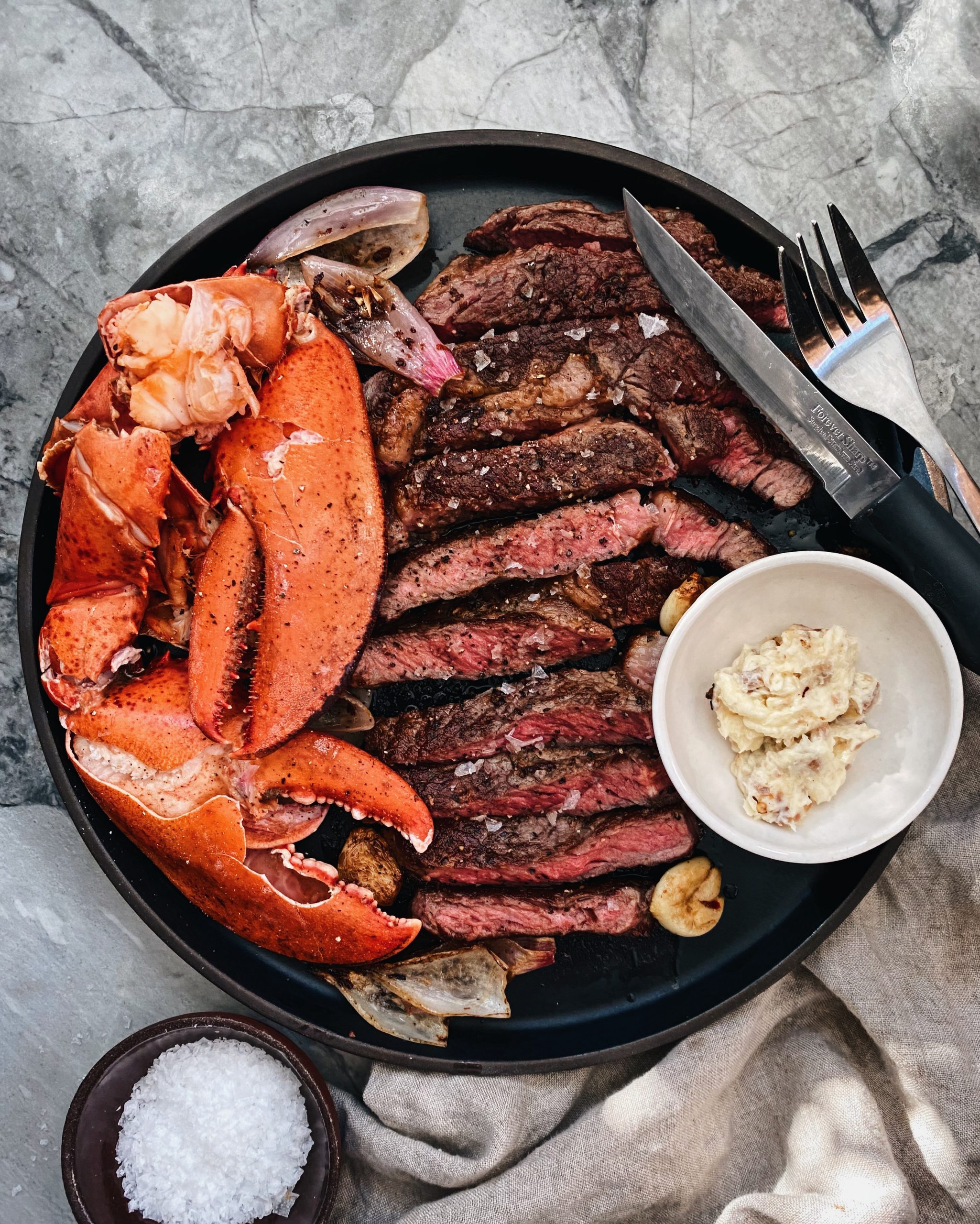 plate of lobster and steak