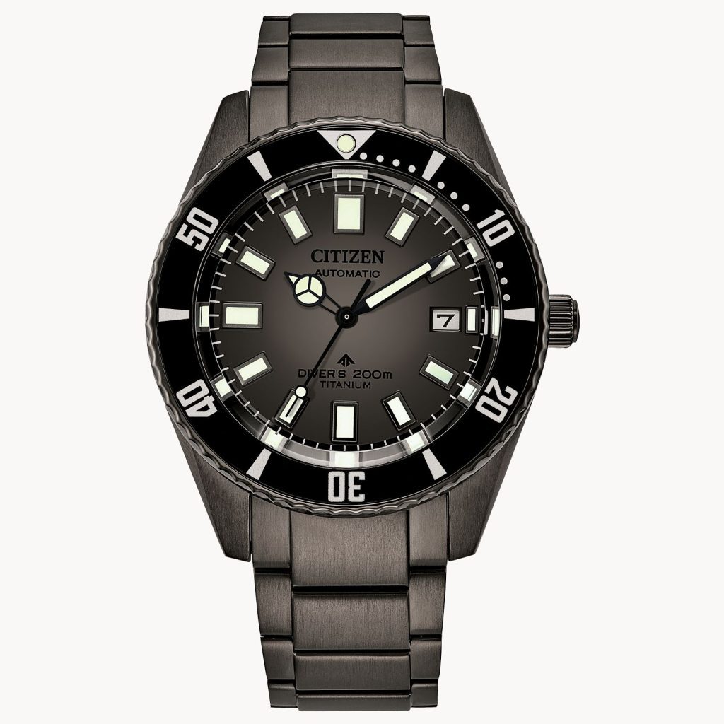 This photo shows the front face of the Citizen Promaster Dive Automatic watch. It has a black band with a black case, and on the case it says "Citizen Automatic Diver's 200M Titanium".