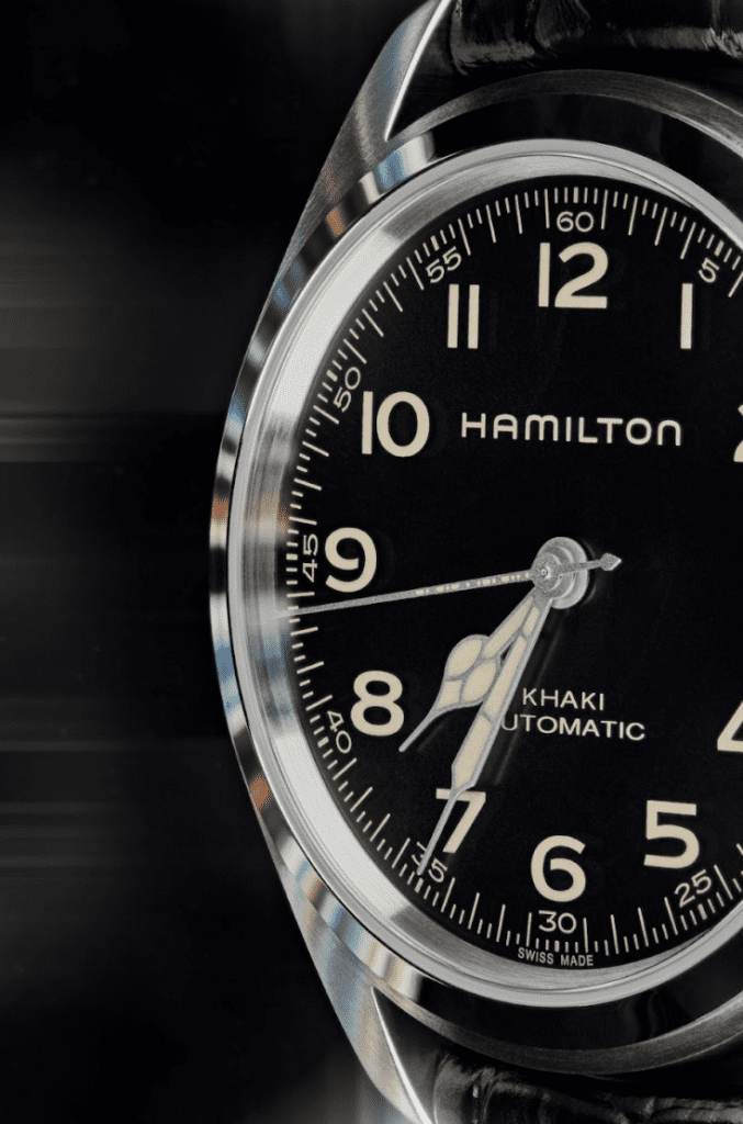 Hamilton timepiece face with silver dial. Rays of light are emitting off of it.