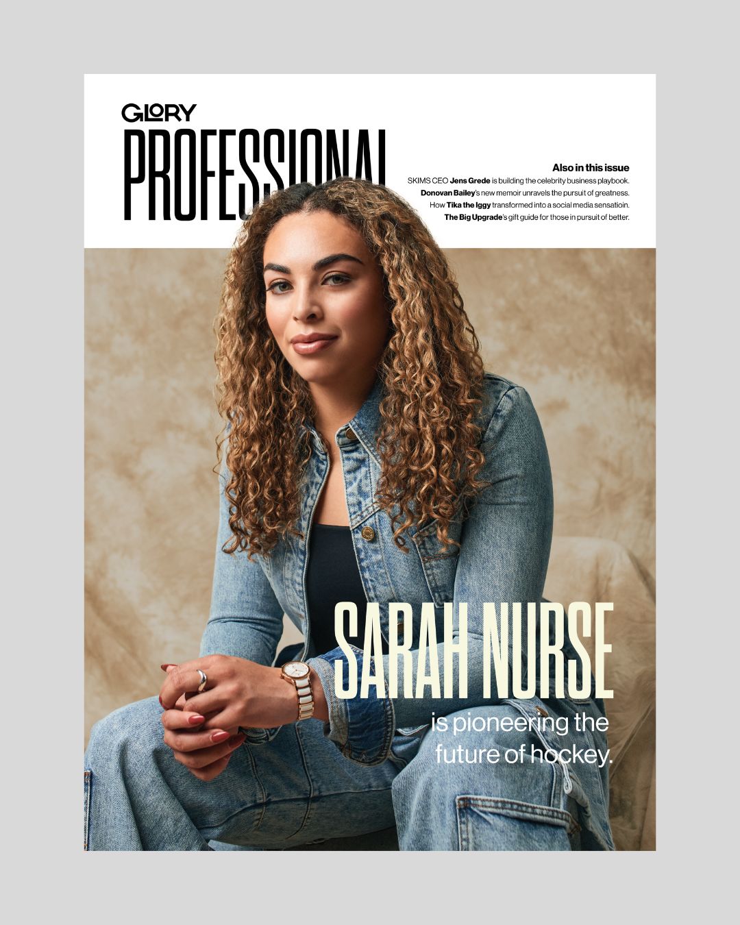 Glory Professional magazine cover featuring Sarah Nurse wearing a denim jacket and pants. She is seated with her elbows on her knees against a brown background.