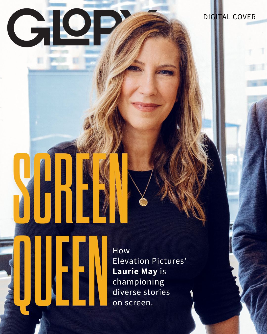 GLORY Magazine cover featuring Laurie May in a black sweater and the words "Screen Queen" overtop. She is resting against a desk with office towers in the background.
