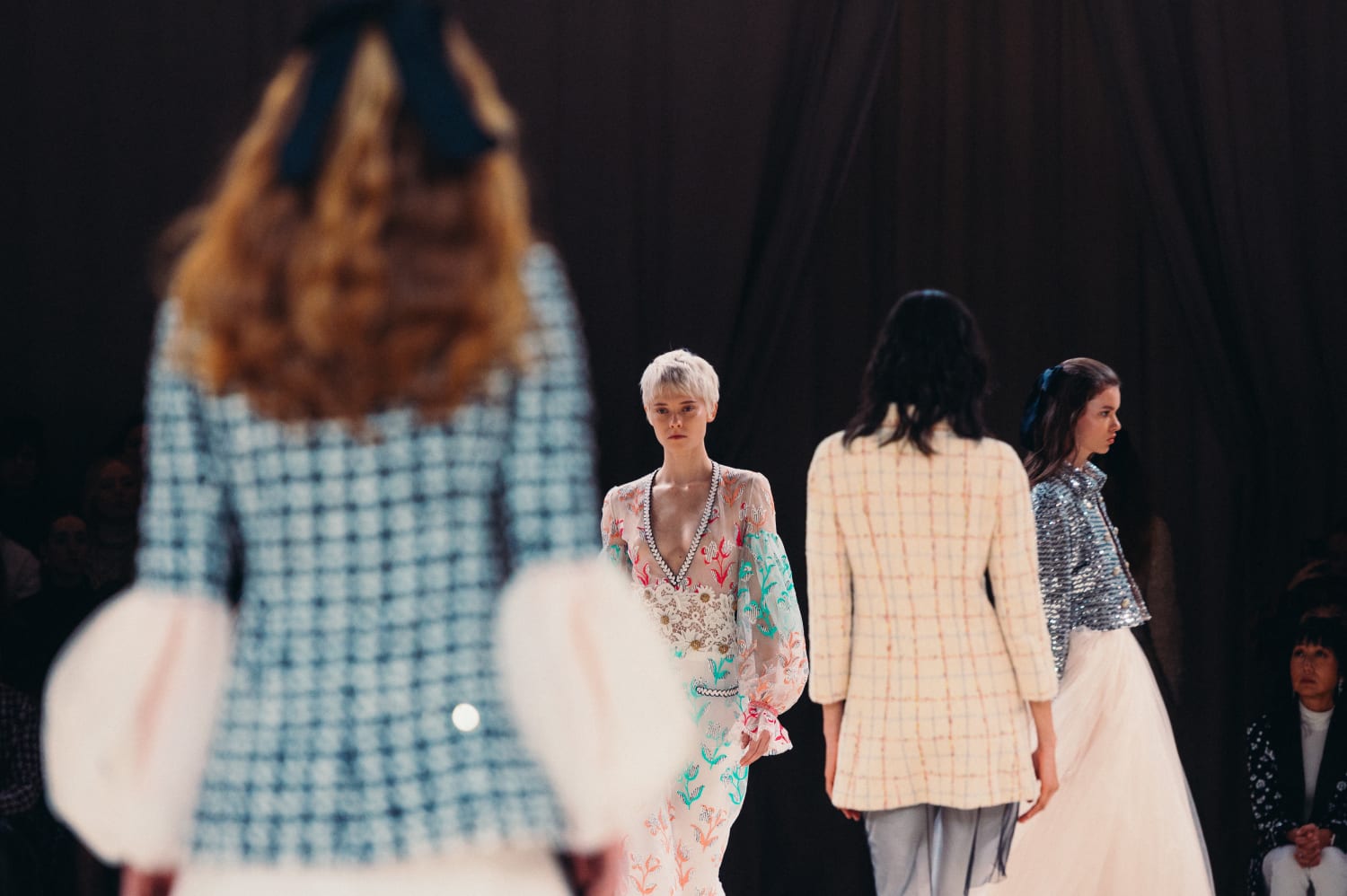 Group of models walking at the CHANEL haute couture show.